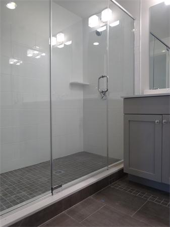 74 F Street, Unit 1 Boston, MA 02127 - Photo 3 of 17 a bathroom with a shower