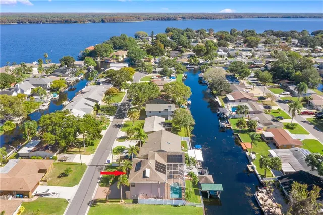an aerial view of residential building and lake