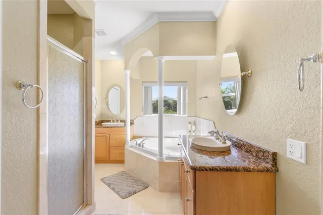 a bathroom with a granite countertop sink mirror and vanity