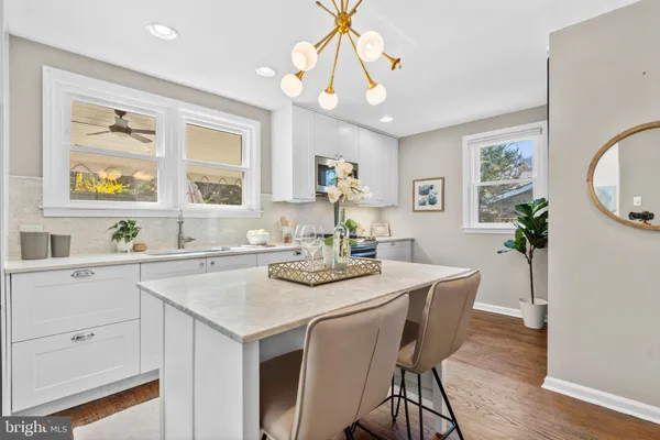 a view of a a dining table and chairs in the kitchen