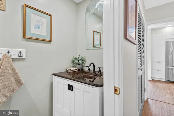 a bathroom with a granite countertop sink