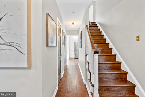 a view of staircase with wooden floor