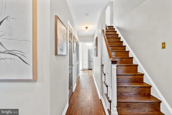 a view of staircase with wooden floor