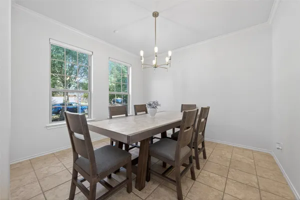 a view of a dining room with furniture window and outside view
