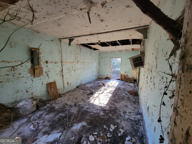 a spacious bathroom with a sink and mirror