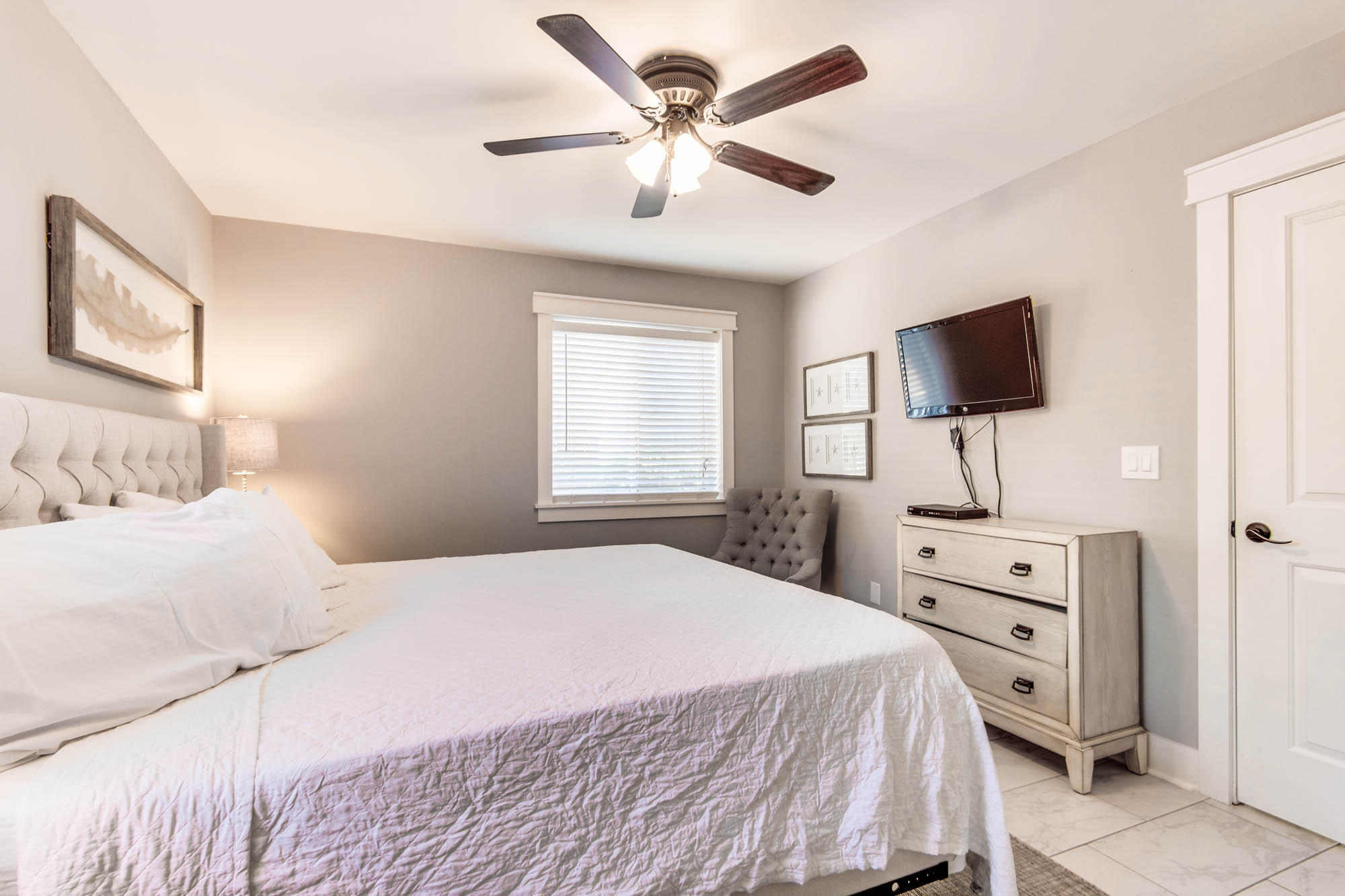 74 Pompano Street Inlet Beach, FL 32461 - Photo 12 of 46 a bedroom with a bed and a flat screen tv
