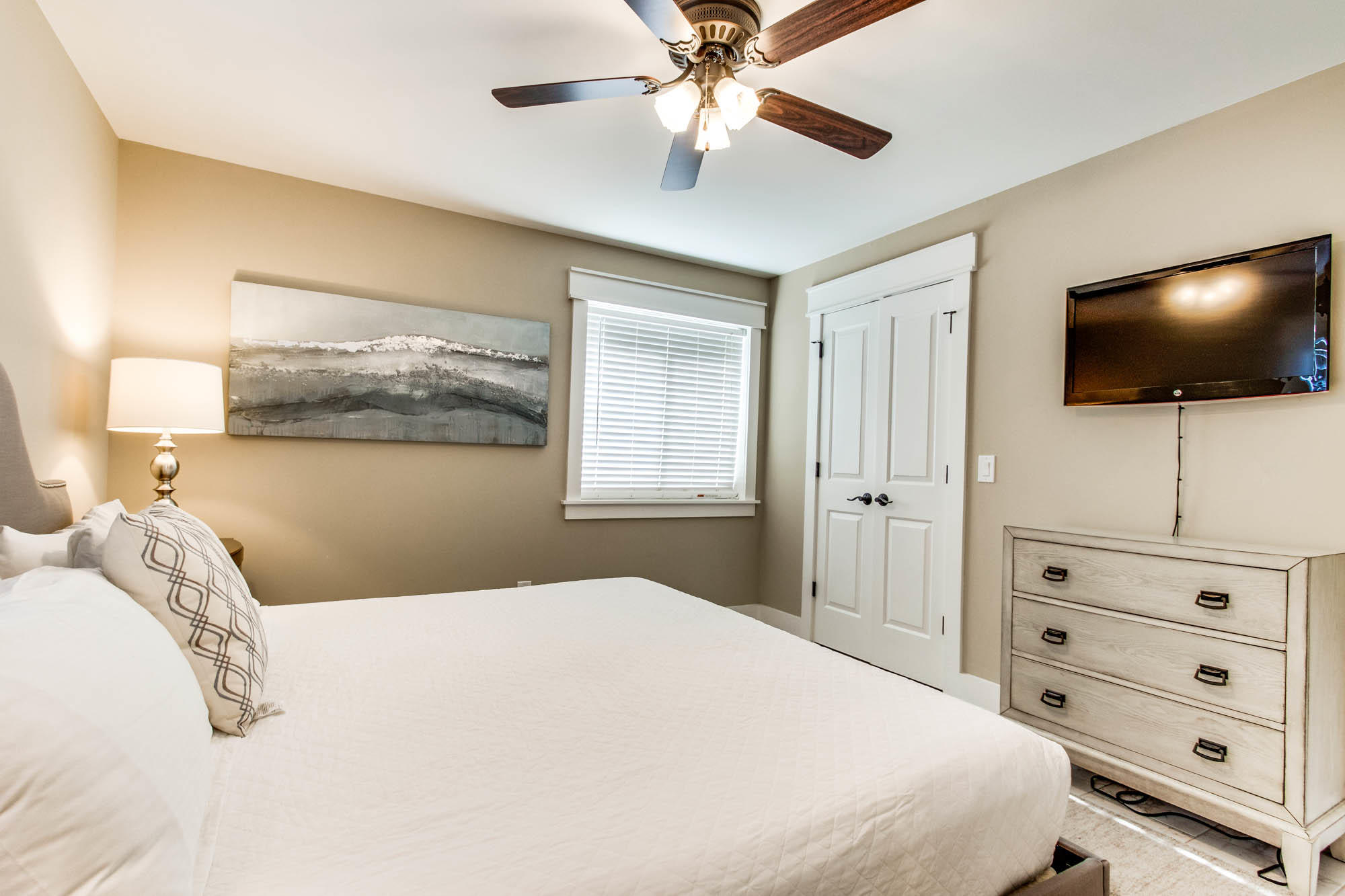 74 Pompano Street Inlet Beach, FL 32461 - Photo 15 of 46 a bedroom with a large bed and a flat screen tv