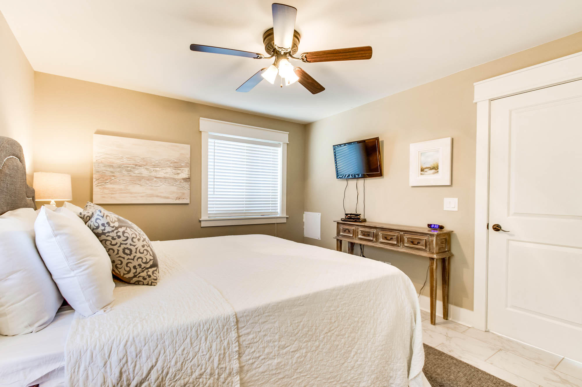 74 Pompano Street Inlet Beach, FL 32461 - Photo 18 of 46 a bedroom with a bed and a flat screen tv