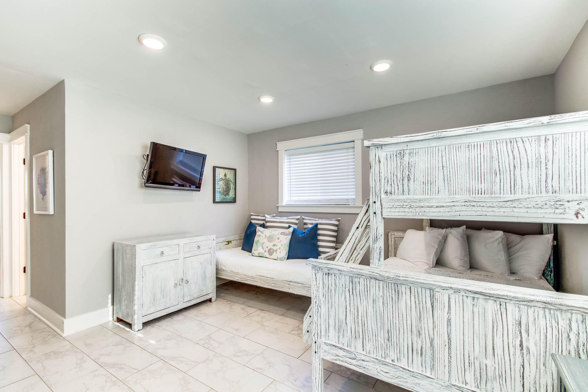 74 Pompano Street Inlet Beach, FL 32461 - Photo 19 of 46 a bedroom with furniture and a flat screen tv