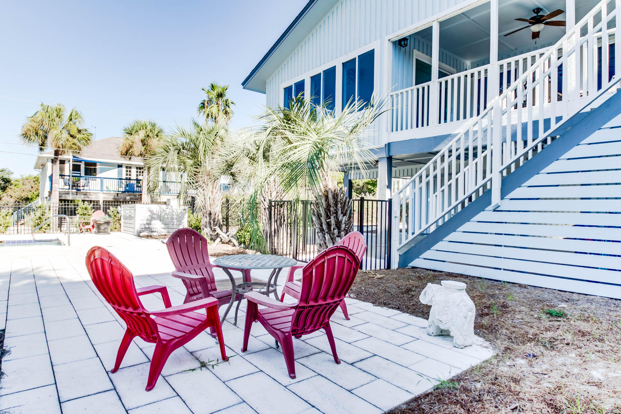 74 Pompano Street Inlet Beach, FL 32461 - Photo 30 of 46 a view of a chairs and table in patio