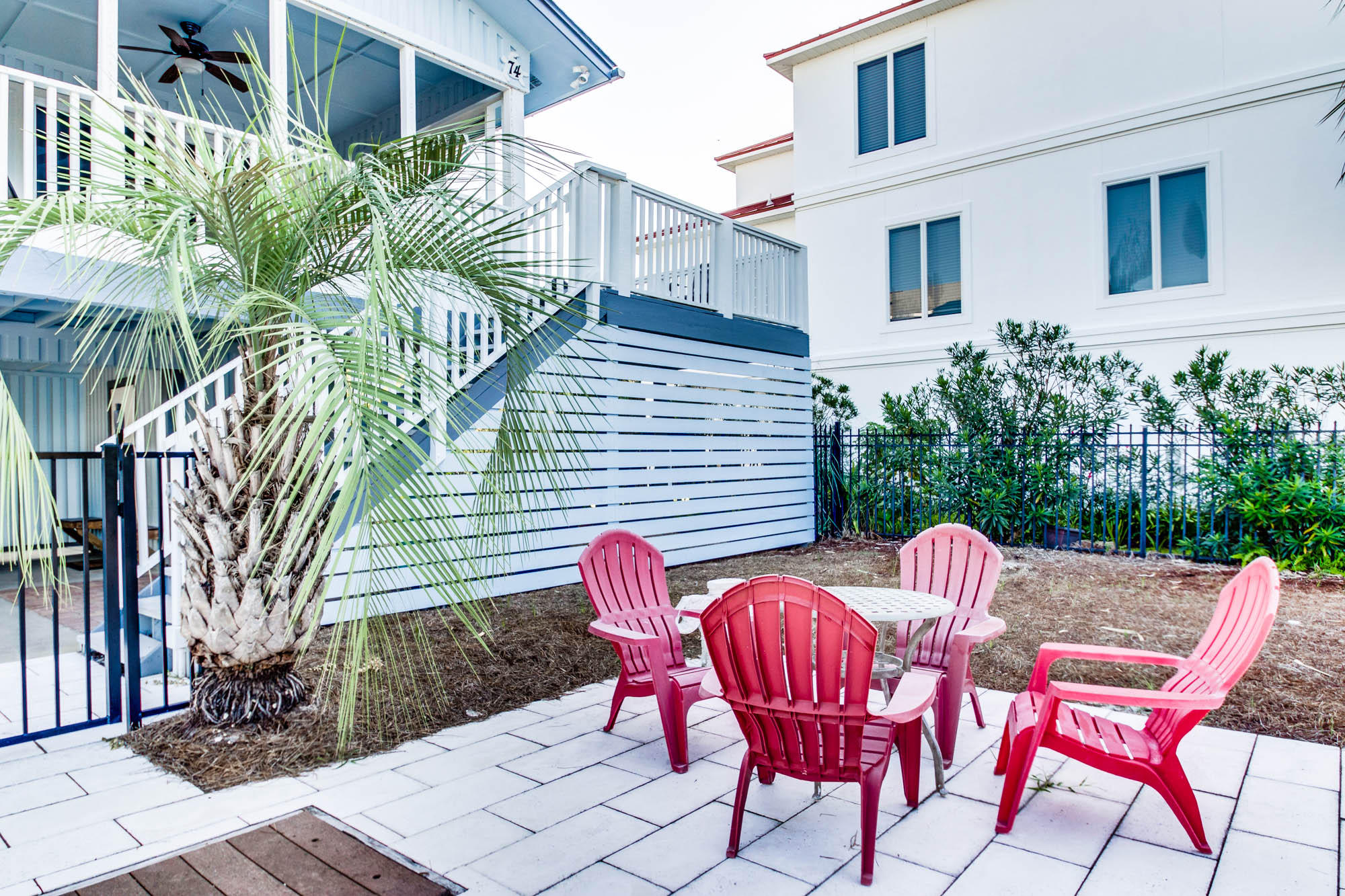 74 Pompano Street Inlet Beach, FL 32461 - Photo 36 of 46 a view of a chairs and table in backyard of the house
