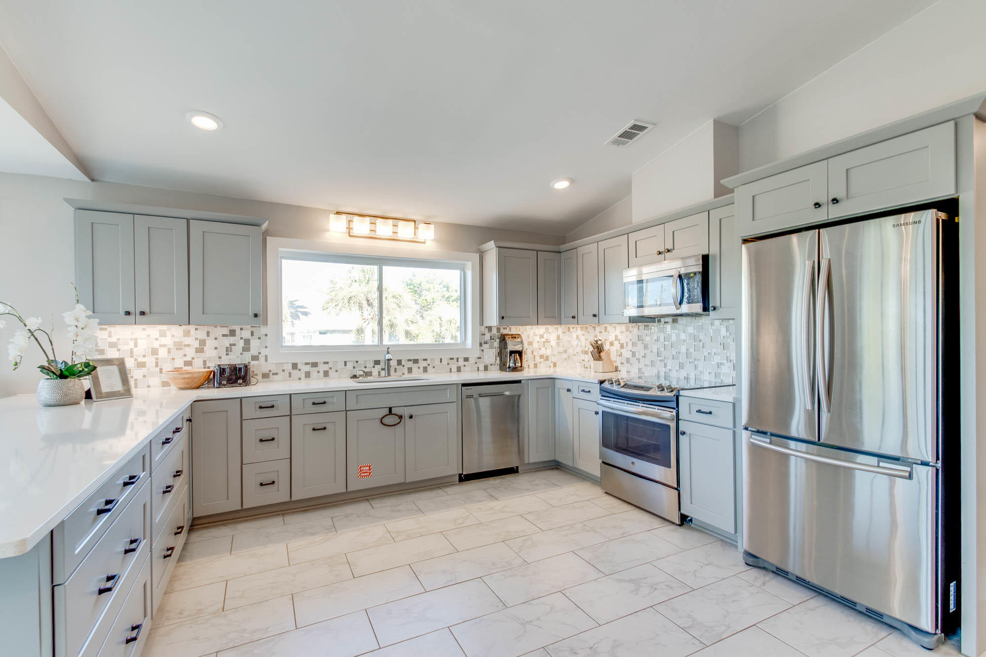 74 Pompano Street Inlet Beach, FL 32461 - Photo 7 of 46 a kitchen with granite countertop stainless steel appliances a refrigerator sink and stove