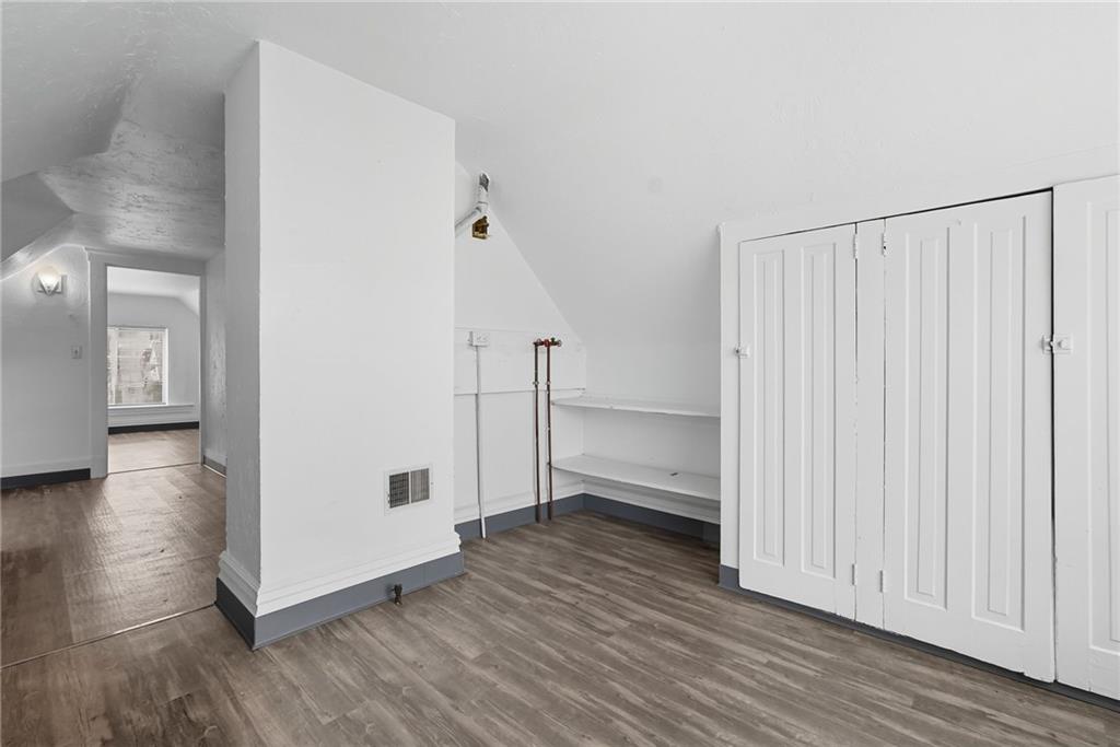 705 Russellwood Avenue McKees Rocks, PA 15136 - Photo 19 of 37 a view of empty room with wooden floor and fan