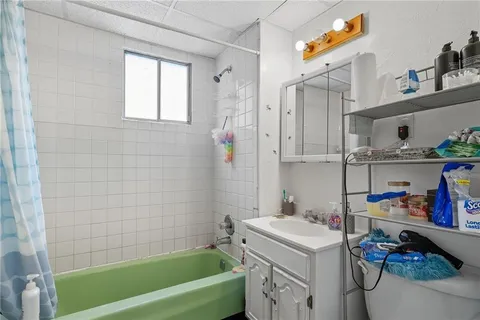 a bathroom with a sink a bath tub and a shower