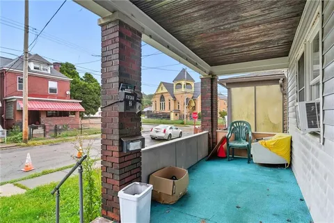 a room with pool table and chairs