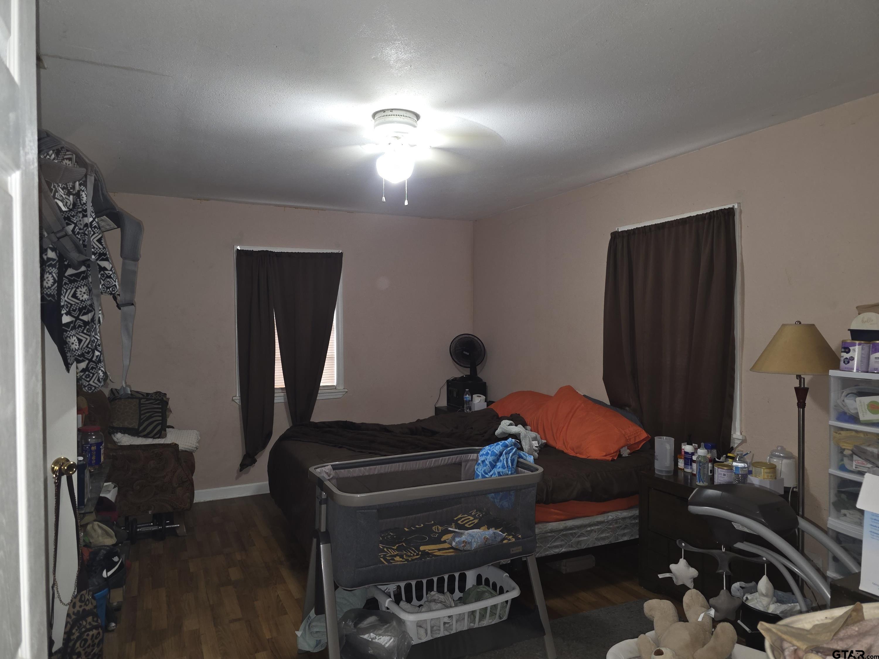 304 Walnut Street Naples, TX 75568 - Photo 19 of 28 a room with furniture and wooden floor