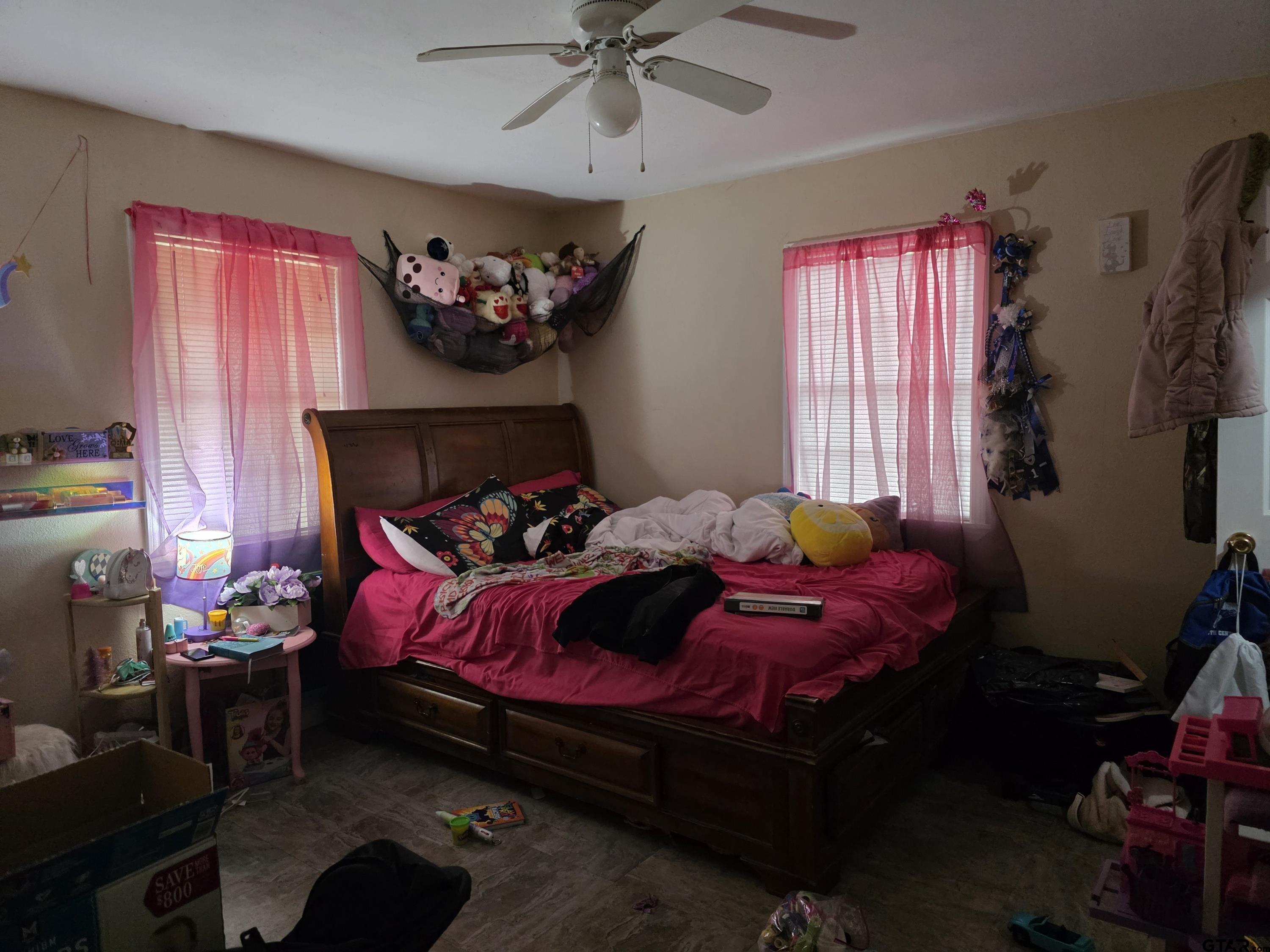 304 Walnut Street Naples, TX 75568 - Photo 20 of 28 a bedroom with a bed and a window