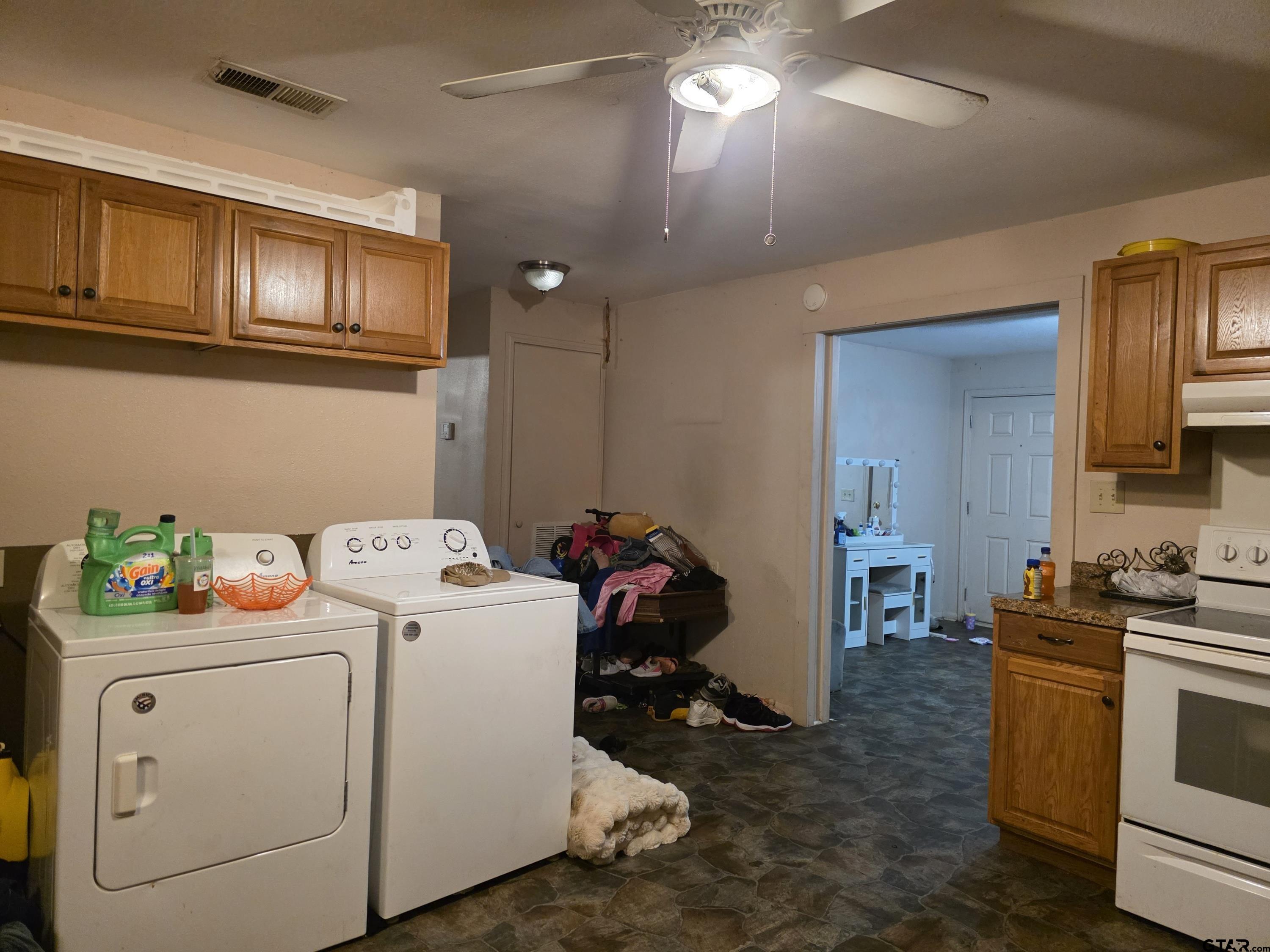 304 Walnut Street Naples, TX 75568 - Photo 26 of 28 a storage room with washer and dryer