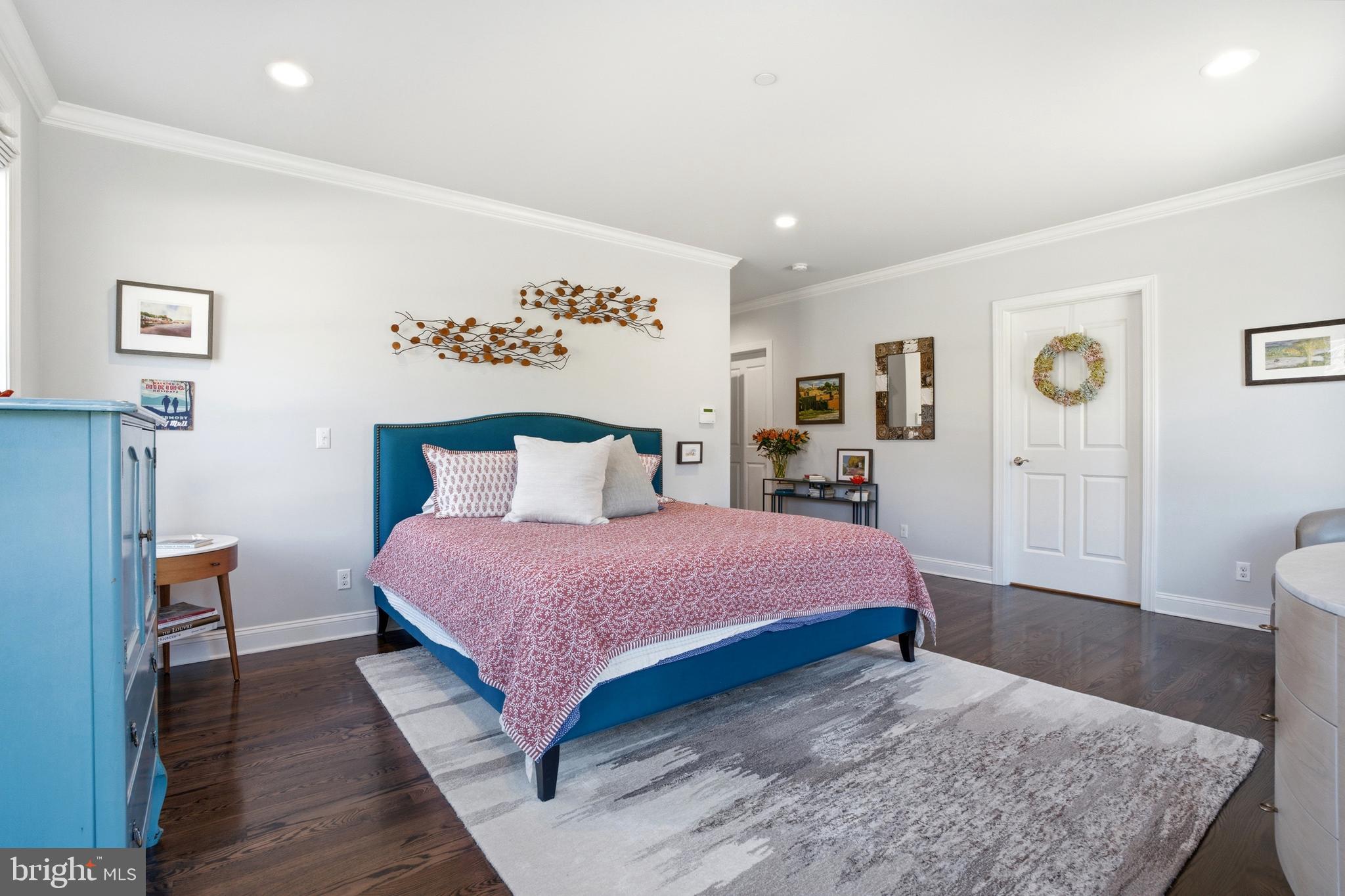 2401 Lower State Road, Unit 106 Doylestown, PA 18901 - Photo 14 of 56 a bedroom with a bed and wooden floor