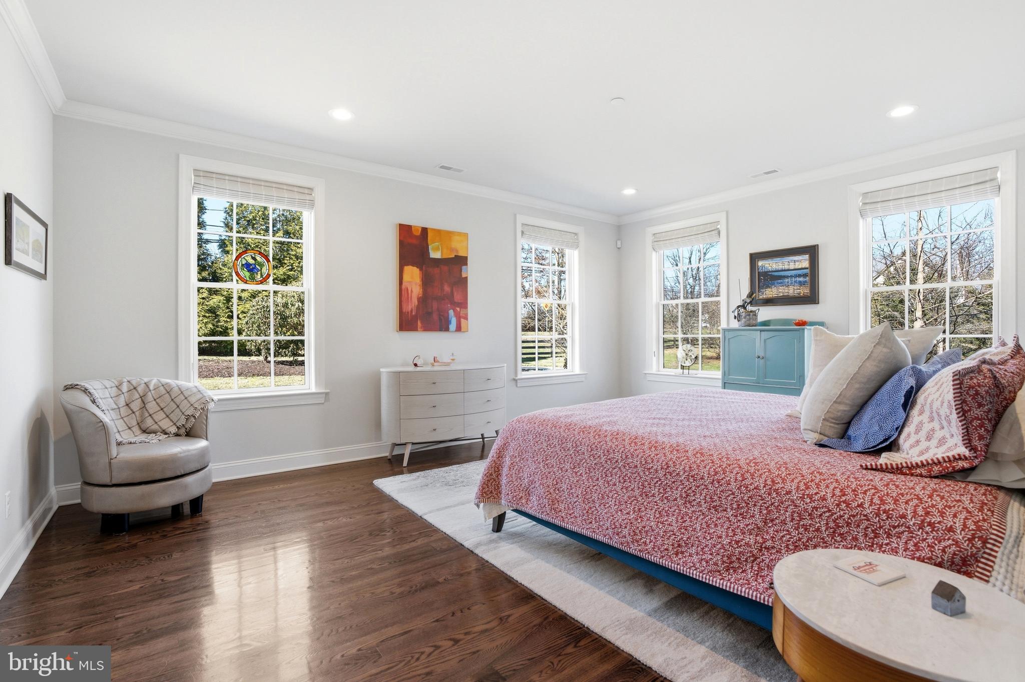2401 Lower State Road, Unit 106 Doylestown, PA 18901 - Photo 15 of 56 a bedroom with a bed and wooden floor