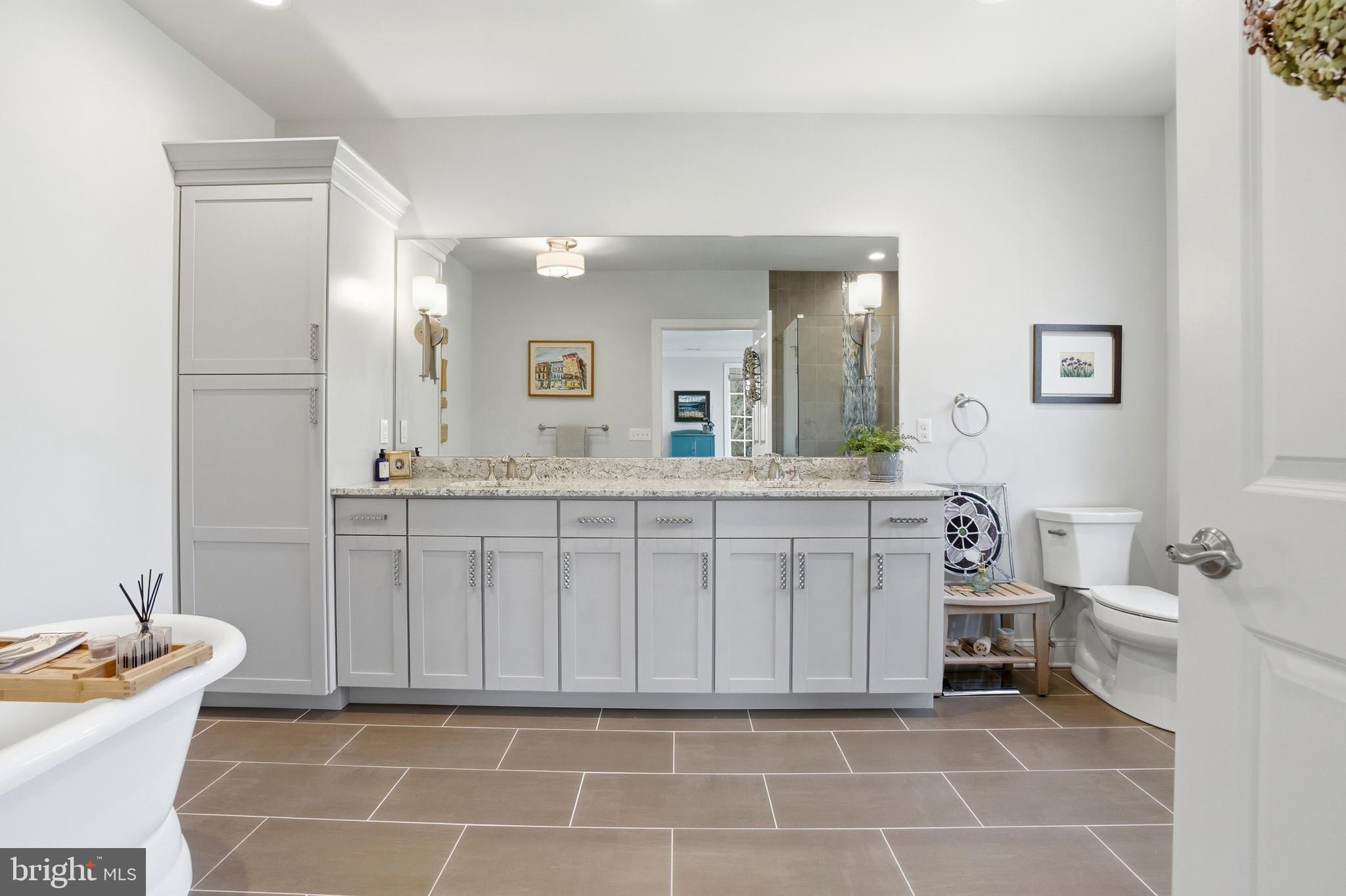 2401 Lower State Road, Unit 106 Doylestown, PA 18901 - Photo 17 of 56 a bathroom with a sink and a mirror