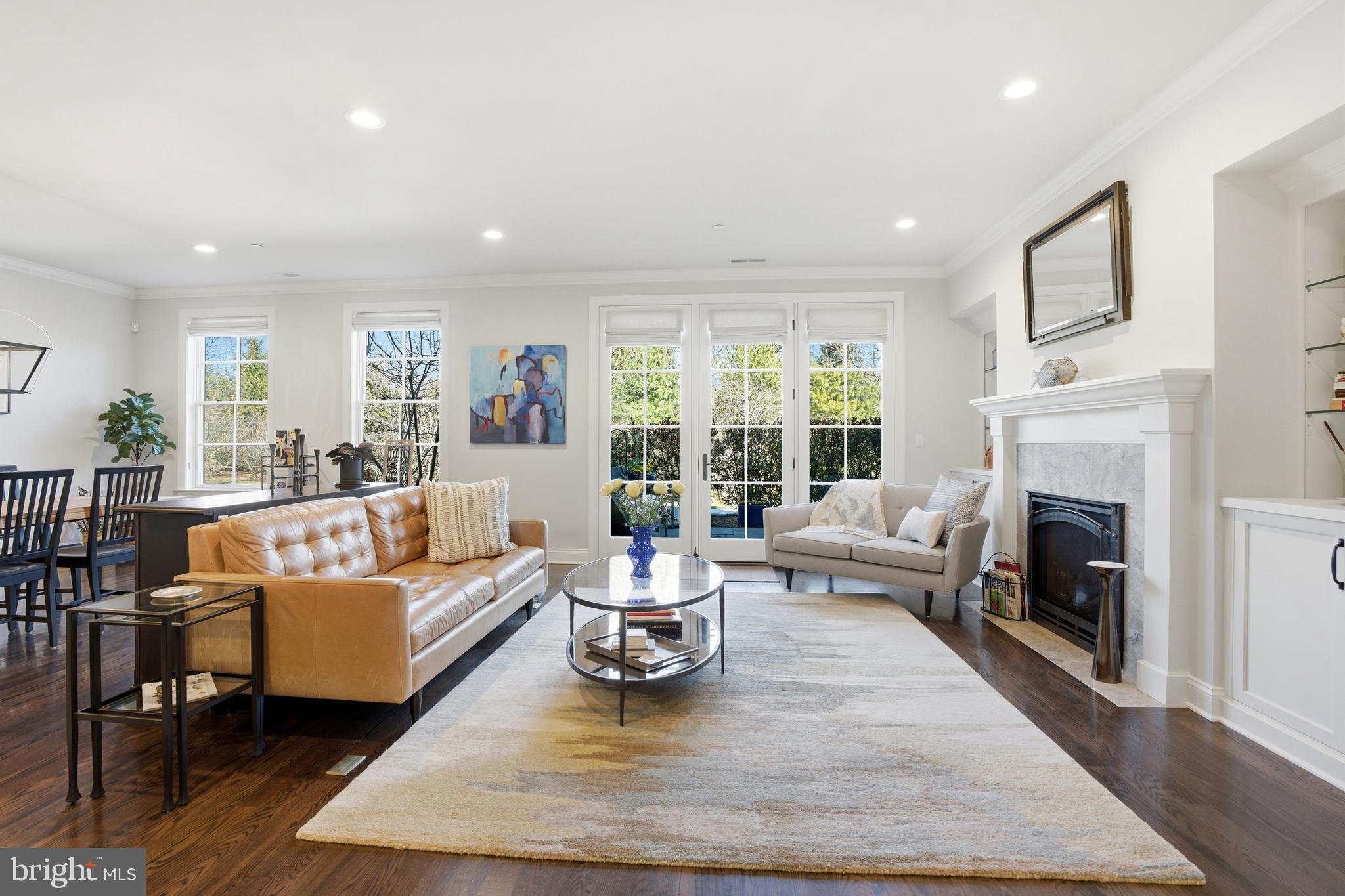 2401 Lower State Road, Unit 106 Doylestown, PA 18901 - Photo 2 of 56 a living room with furniture and a fireplace