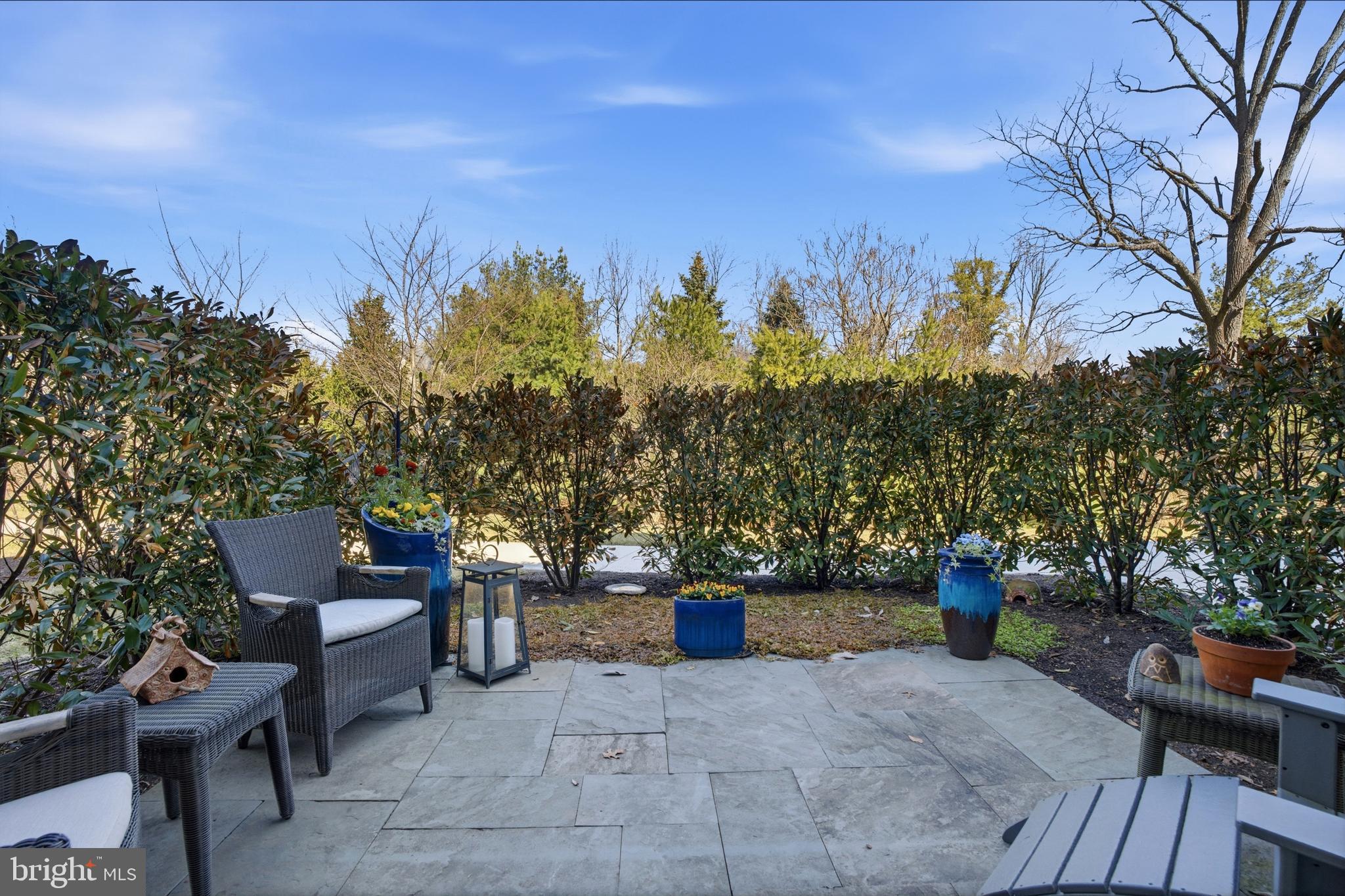 2401 Lower State Road, Unit 106 Doylestown, PA 18901 - Photo 2 of 2 a view of a patio with couches and table and chairs and potted plants