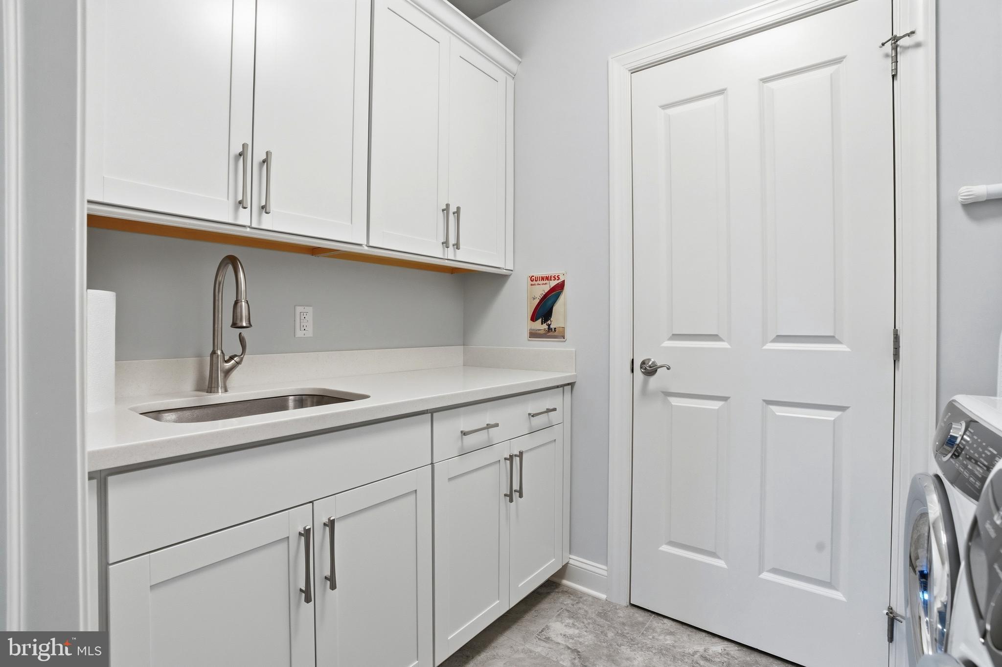 2401 Lower State Road, Unit 106 Doylestown, PA 18901 - Photo 26 of 56 a kitchen with white cabinets and sink