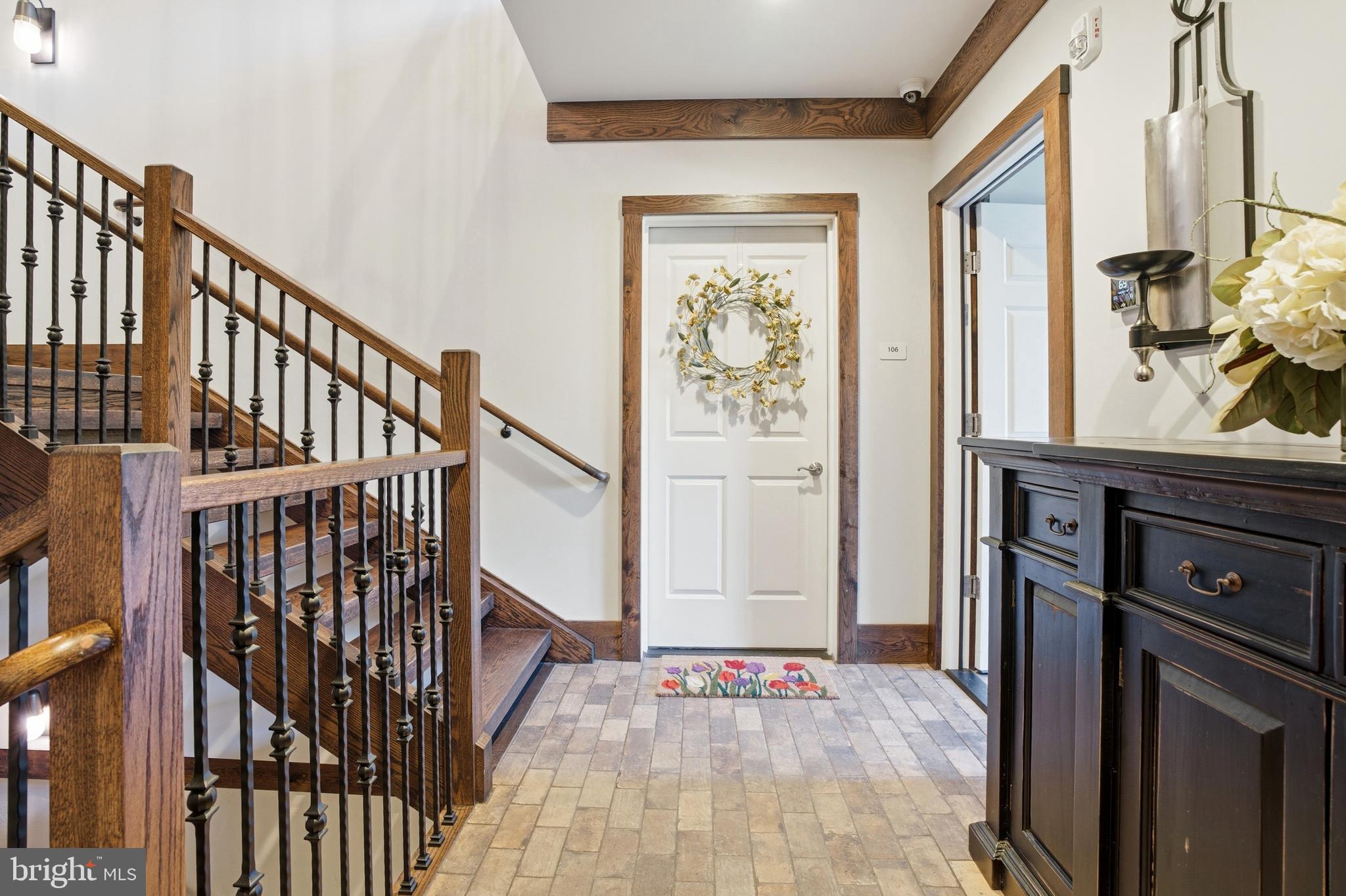 2401 Lower State Road, Unit 106 Doylestown, PA 18901 - Photo 56 of 56 a view of a hallway with wooden floor and staircase