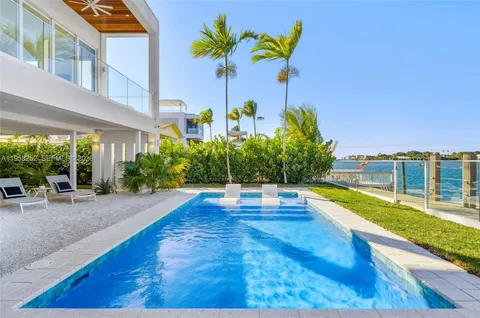 a view of a swimming pool with an outdoor seating