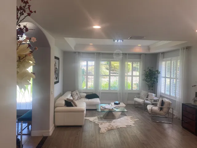 a view of a dining room with furniture and window