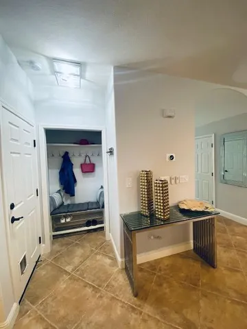 a bedroom with a bed and a chair