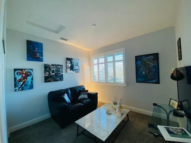 a room with a bed and a large window