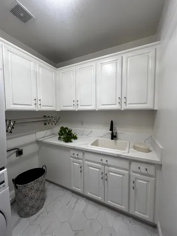 a view of balcony with table and chairs