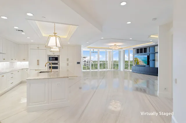 a view of a kitchen with a sink and cabinets