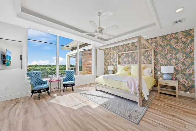 a bed room with a bed and a chair