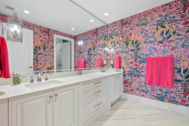 a bathroom with a sink mirror and vanity