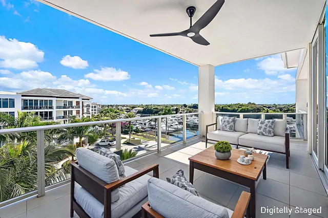 a view of a terrace with furniture and a view of city