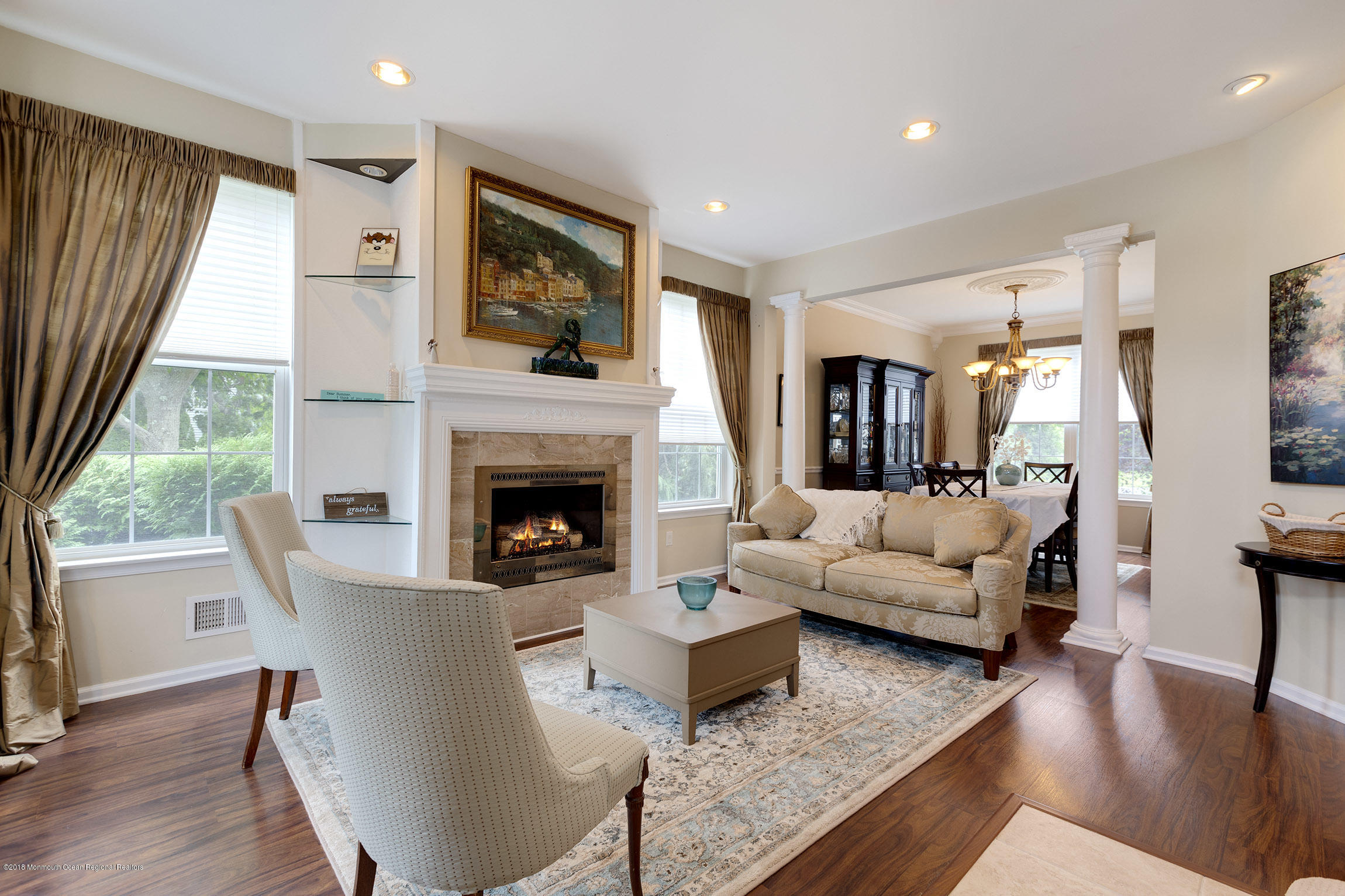 1 Lafayette Key Colts Neck, NJ 07722 - Photo 1 of 25 a living room with fireplace furniture and a large window
