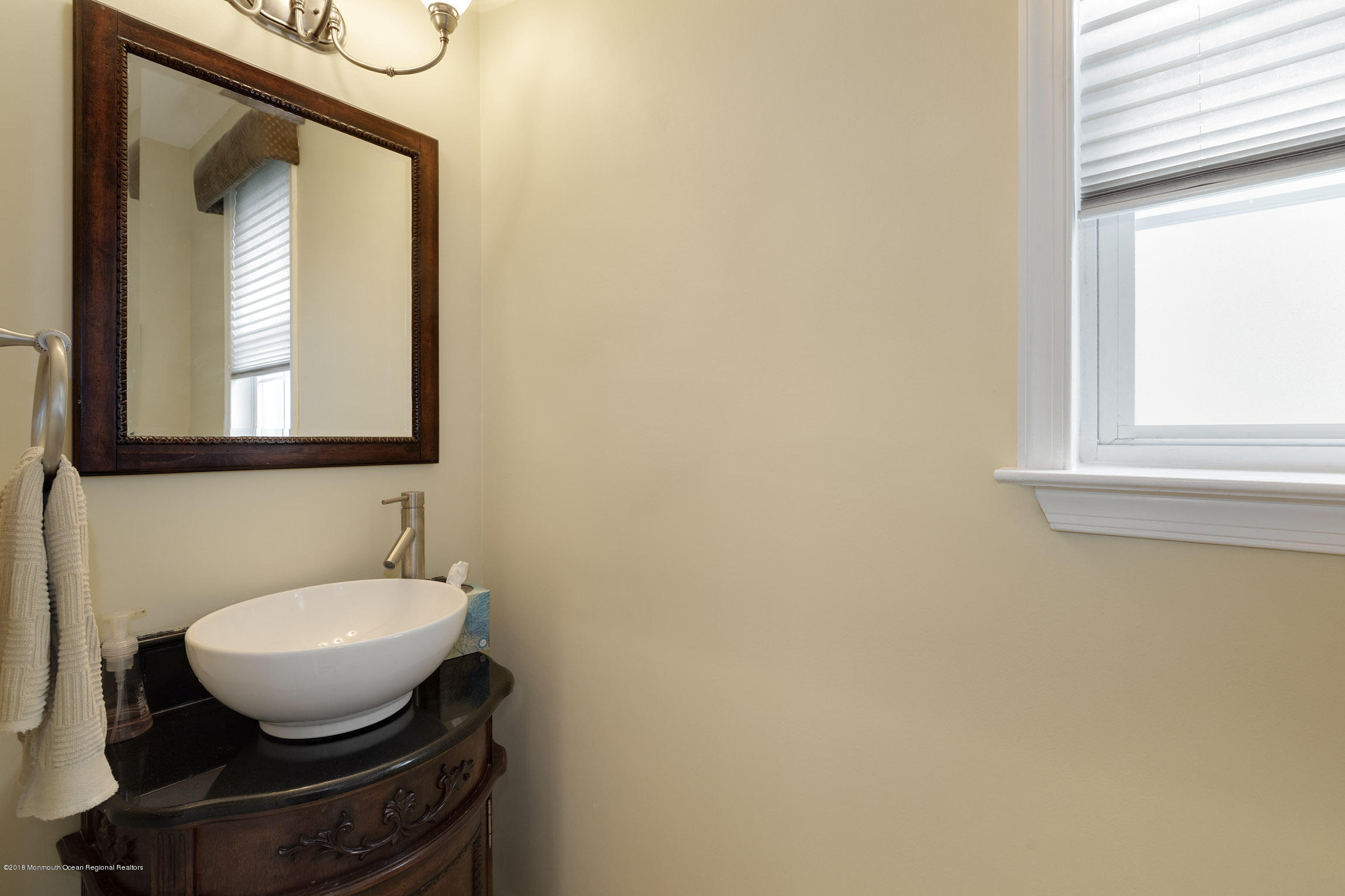 1 Lafayette Key Colts Neck, NJ 07722 - Photo 12 of 25 a bathroom with a toilet sink and mirror