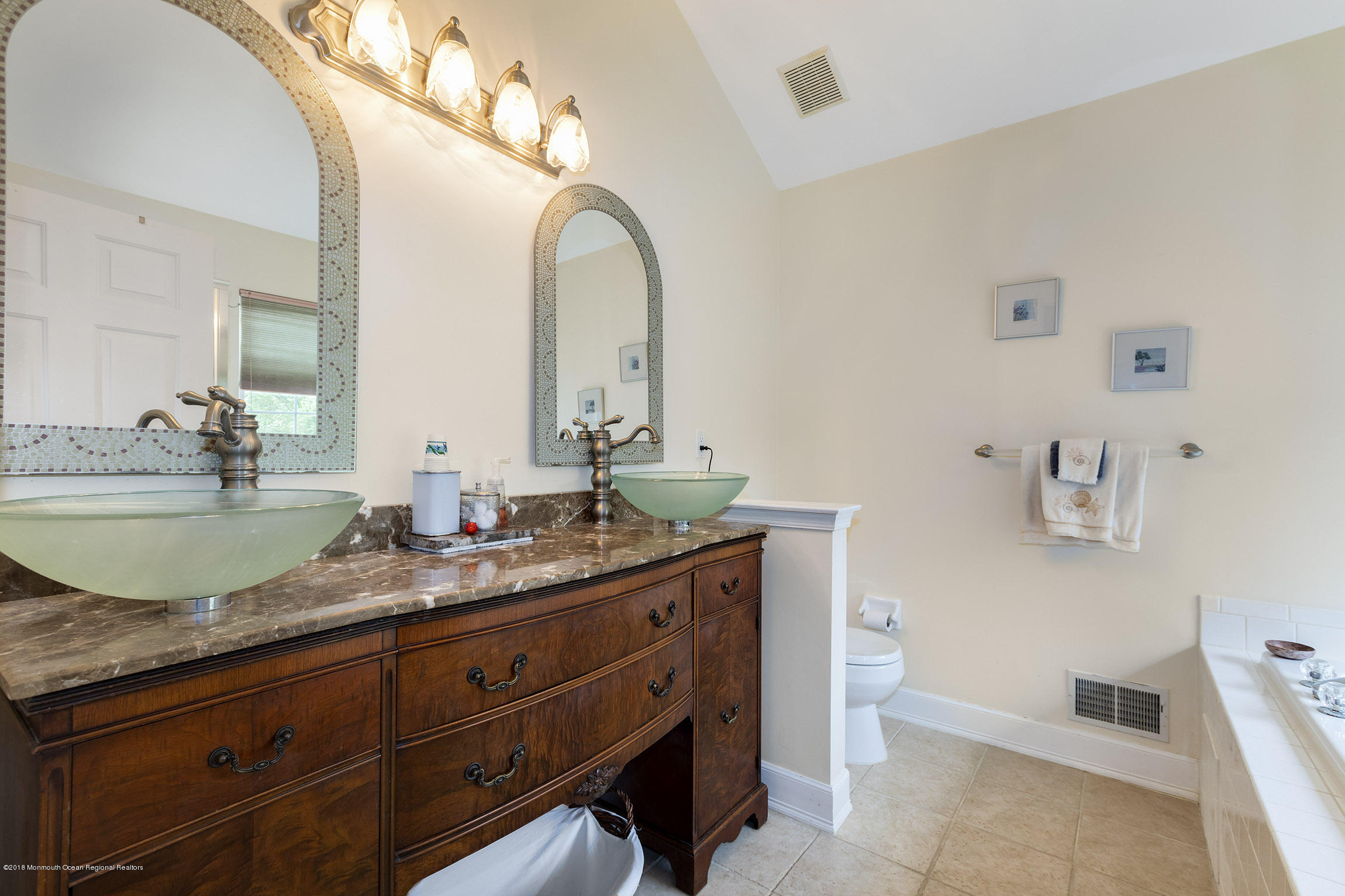 1 Lafayette Key Colts Neck, NJ 07722 - Photo 15 of 25 a bathroom with a granite countertop sink a mirror and vanity