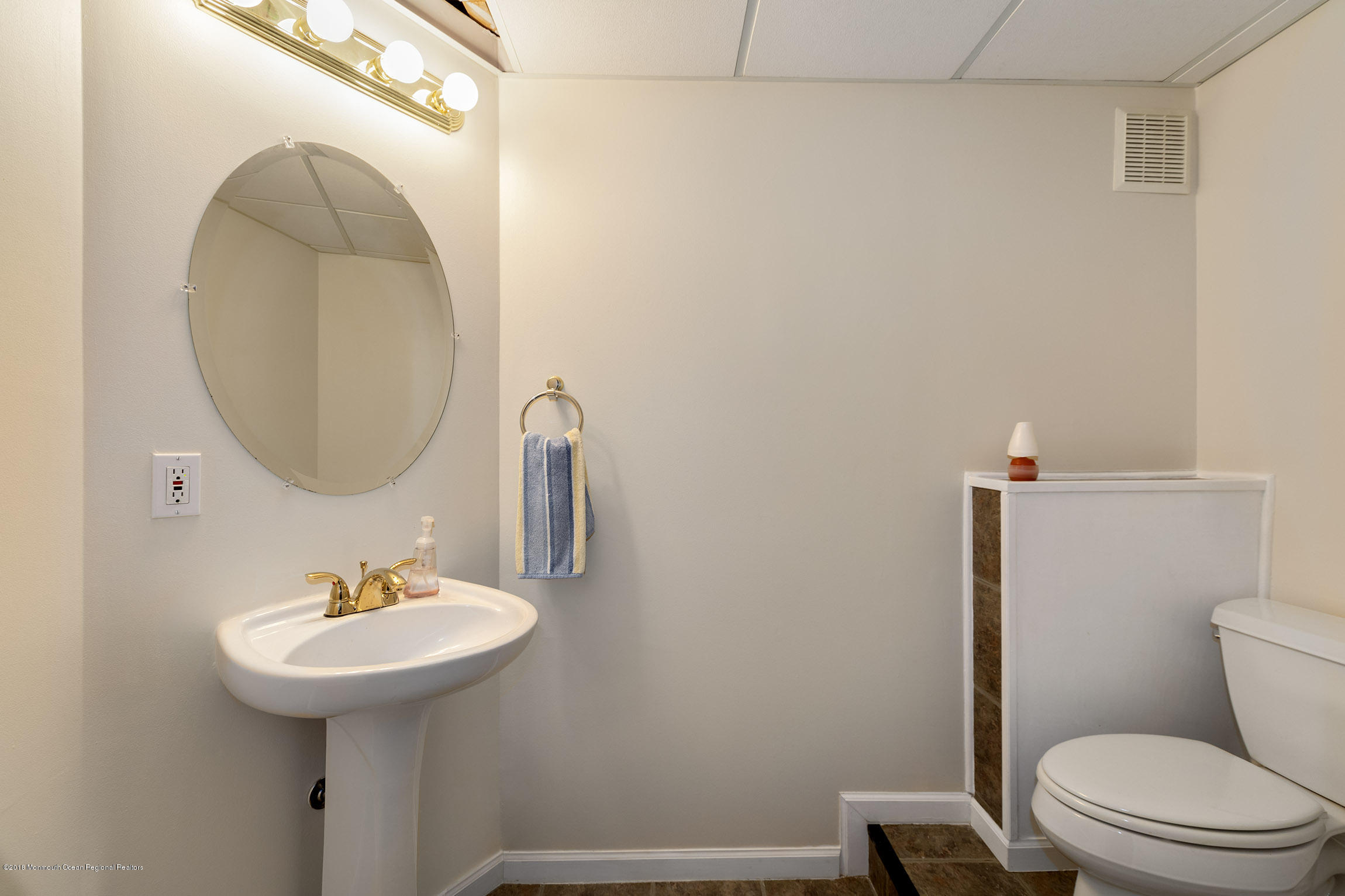 1 Lafayette Key Colts Neck, NJ 07722 - Photo 23 of 25 a bathroom with a sink toilet and mirror