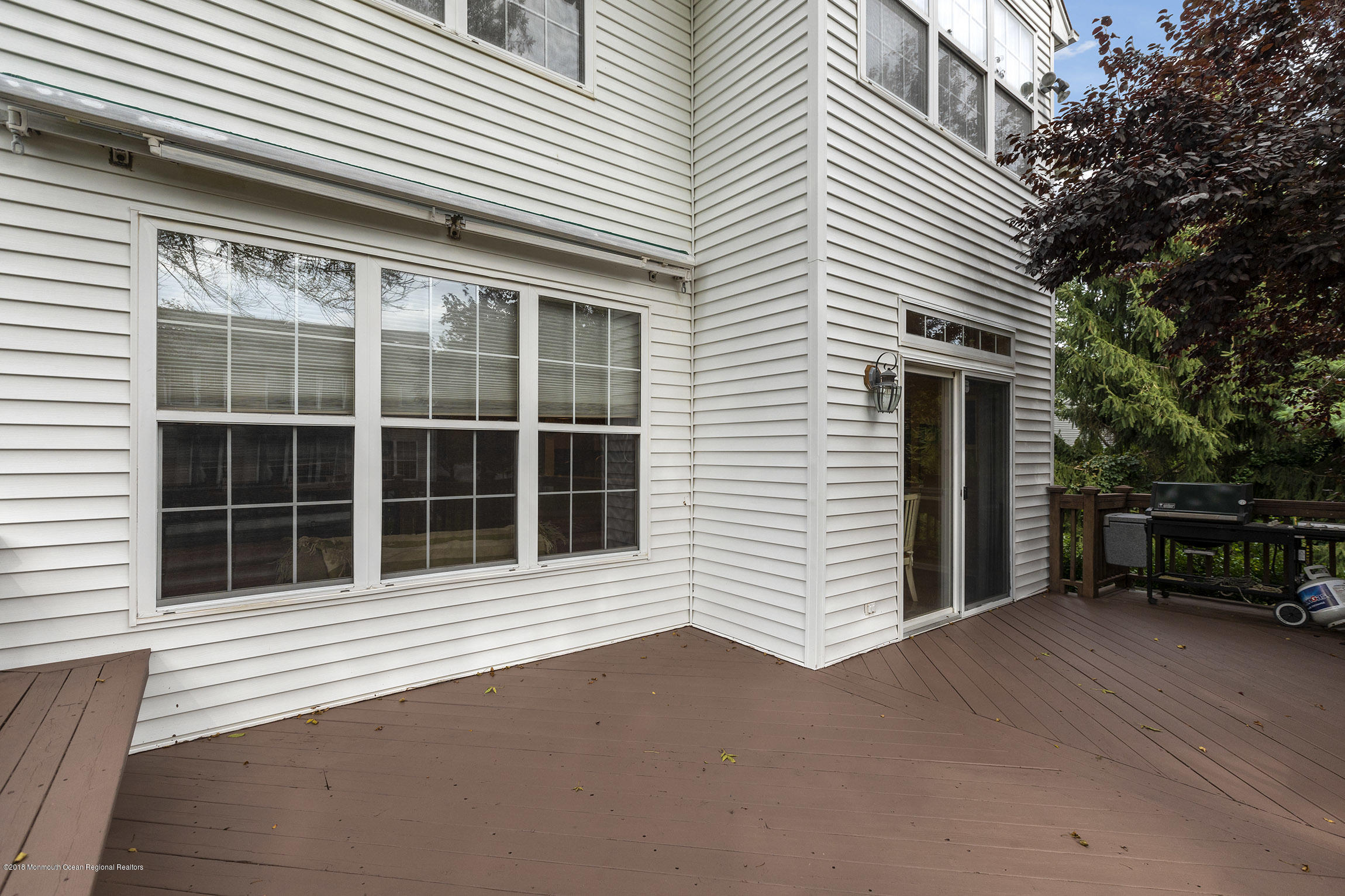 1 Lafayette Key Colts Neck, NJ 07722 - Photo 25 of 25 a view of a house with a large window and wooden fence