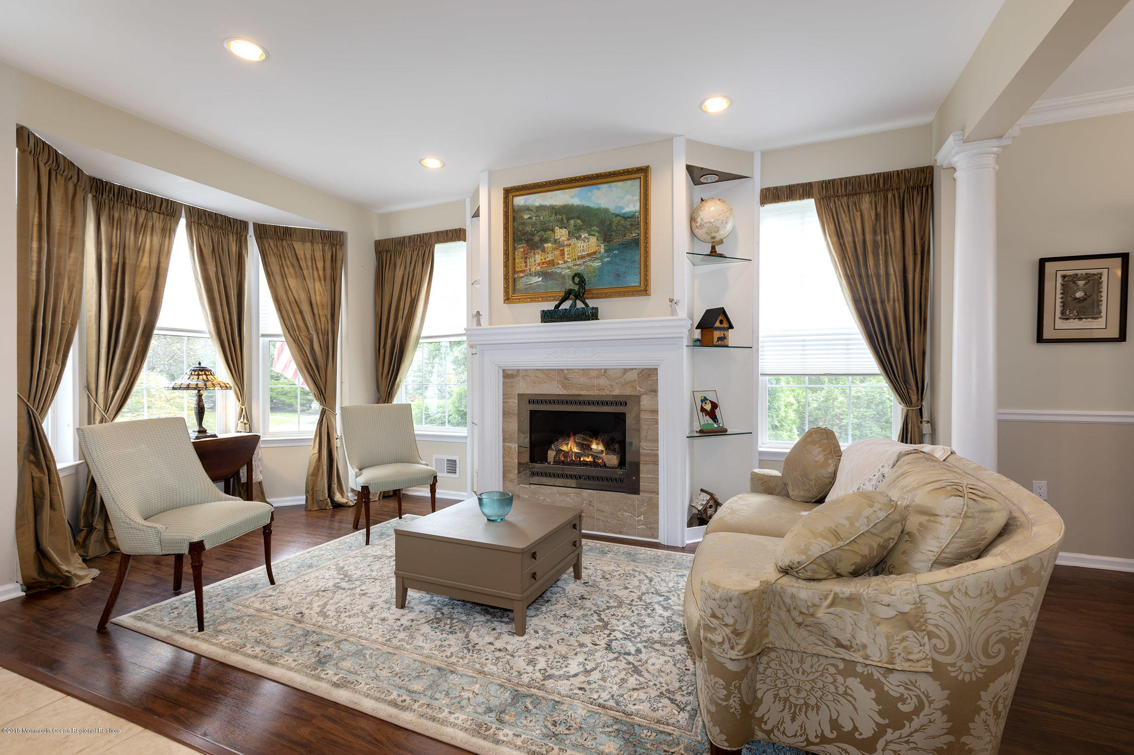 1 Lafayette Key Colts Neck, NJ 07722 - Photo 4 of 25 a living room with furniture and a fireplace