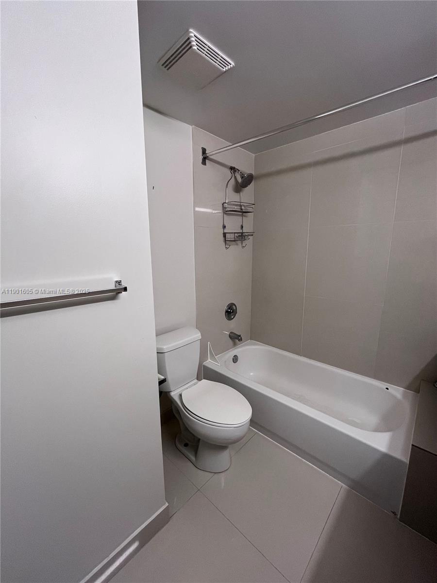 601 Northeast 23rd Street, Unit 606 Miami, FL 33137 - Photo 16 of 26 a bathroom with a sink a toilet and shower