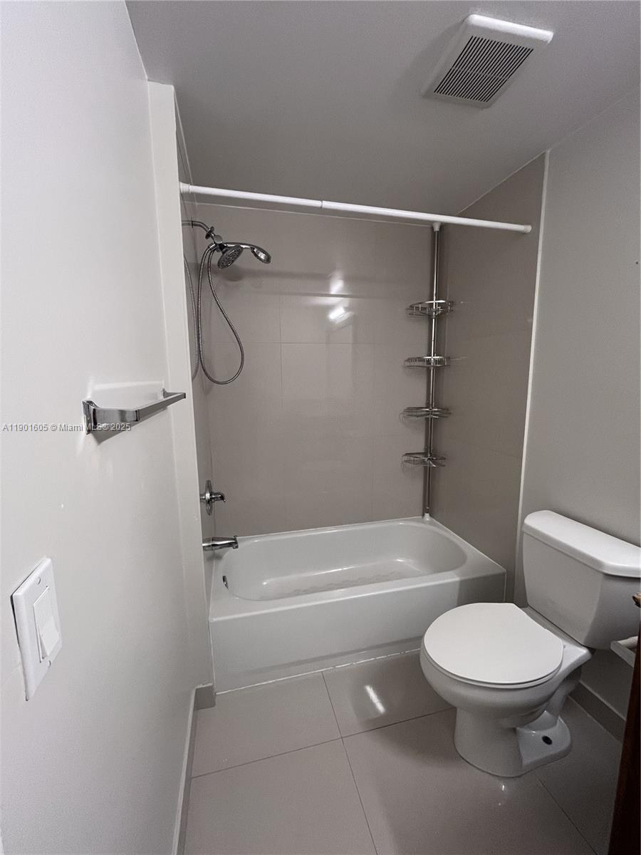 601 Northeast 23rd Street, Unit 606 Miami, FL 33137 - Photo 8 of 26 a bathroom with a toilet and a shower