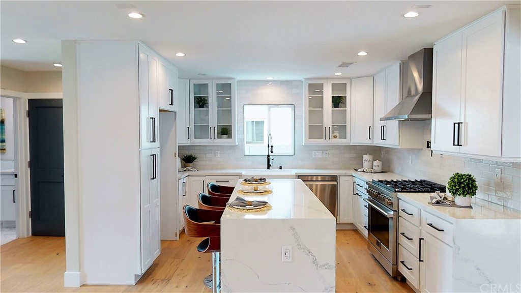 5035 Avenue B Torrance, CA 90505 - Photo 11 of 60 a kitchen that has a lot of cabinets in it and appliances