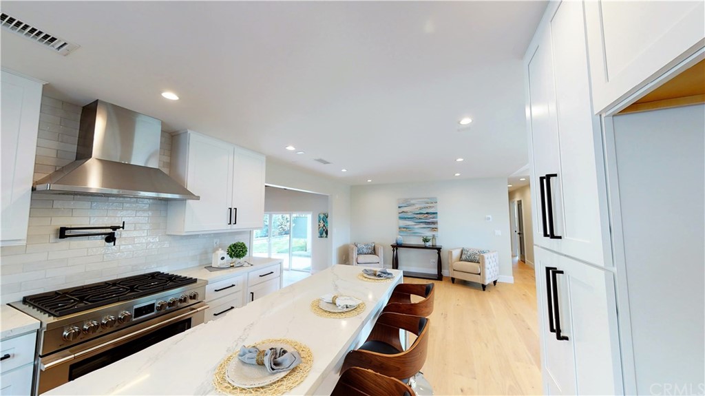 5035 Avenue B Torrance, CA 90505 - Photo 12 of 60 a kitchen with stainless steel appliances a stove a sink and a refrigerator