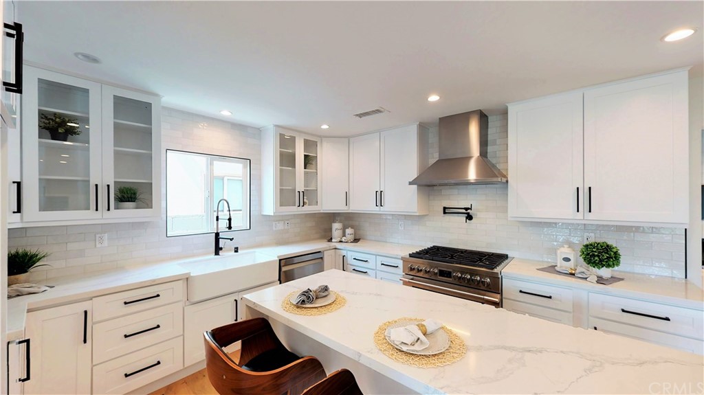 5035 Avenue B Torrance, CA 90505 - Photo 13 of 60 a kitchen with stainless steel appliances granite countertop a sink and cabinets