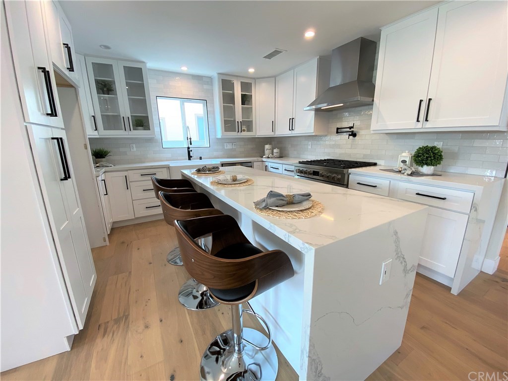 5035 Avenue B Torrance, CA 90505 - Photo 15 of 60 a kitchen with a stove a sink and a refrigerator